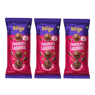 Three identical packages of Binge Chocolate Laddoo arranged side by side on a plain white background. Each package is purple and pink, with a photo of chocolate laddoo balls and text reading 'Binge' and 'Chocolate Laddoos'.